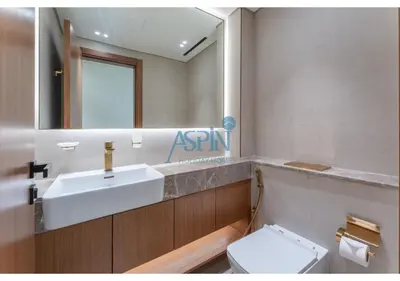 a bathroom with a sink and a toilet and a mirror at Aspin Brand New Cozy 1BR at Binghatti Lavender JVC in Dubai