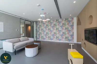 a living room with a couch and a table at Vogue Downtown Views II with Direct Access to Dubai Mall Via a Climate Controlled Bridge, One Bedroom Apartment with Balcony and City View in Dubai