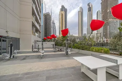 a view of a city from a building with red balloons at Luxury Canal View Studio for 4 Guests in Downtown, 5 Min to Dubai Mall in Dubai