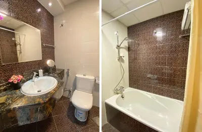 a bathroom with a toilet and a sink and a tub at Stylish Studio near the beach in Dubai Marina in Dubai