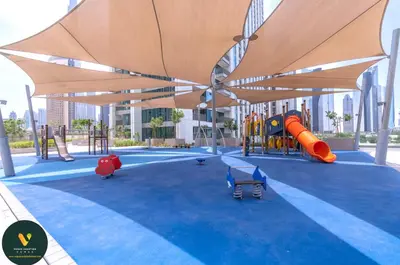 a playground with a slide and awning in a building at Vogue Downtown Views II with Direct Access to Dubai Mall Via a Climate Controlled Bridge, One Bedroom Apartment with Balcony and City View in Dubai