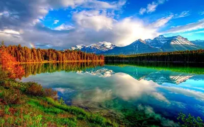 a reflection of the mountains in a lake at X8363 - Apartment #101, Floor - 1, Dubai Investmen in Dubai