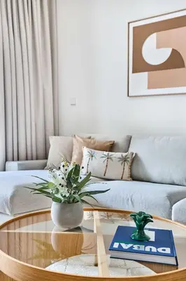a living room with a coffee table and a couch at Frank Porter - Grove at Creek Beach Building in Dubai