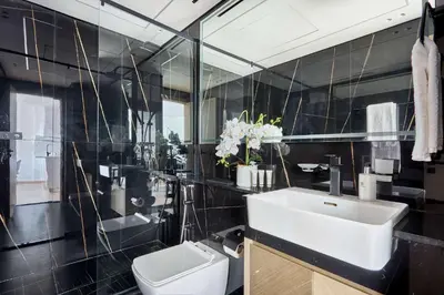 a bathroom with a sink and a toilet at Frank Porter - Binghatti Corner in Dubai
