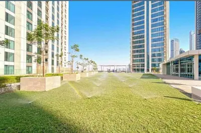 an empty street in a city with tall buildings at Stunning Apartment - Downtown View 2 - Tower 1 - Fountain and Burj Khalifa view 61st floor in Dubai