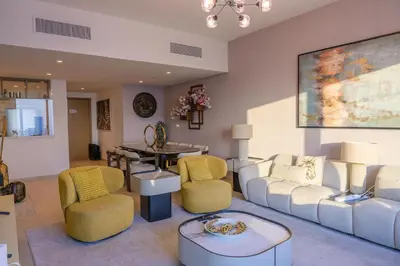 a living room with a couch and chairs and a table at Stunning Apartment - Downtown View 2 - Tower 1 - Fountain and Burj Khalifa view 61st floor in Dubai