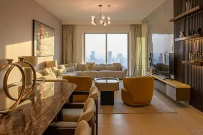a large living room with a couch and chairs at Stunning Apartment - Downtown View 2 - Tower 1 - Fountain and Burj Khalifa view 61st floor in Dubai