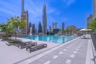 a swimming pool on the roof of a building at Vogue Downtown Views II with Direct Access to Dubai Mall Via a Climate Controlled Bridge, One Bedroom Apartment with Balcony and City View in Dubai