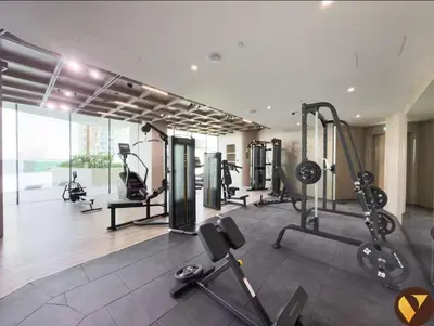 a gym with treadmills and machines in a room at Vogue JVC Binghatti Phantom near Circle Mall, One Bedroom Apartment with a Private Pool in Balcony and full Access to all Amenities in Dubai