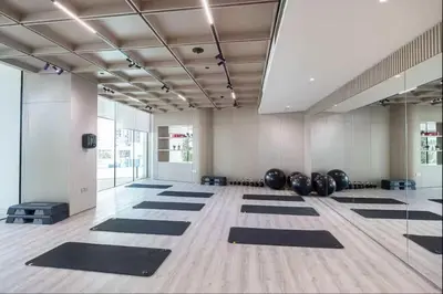 a yoga room with black mats on the floor at Vogue JVC Binghatti Phantom near Circle Mall, One Bedroom Apartment with a Private Pool in Balcony and full Access to all Amenities in Dubai