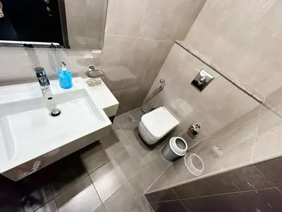 a bathroom with a sink and a toilet at Merano Tower 1BHK in Business Bay By Petals Holiday Homes in Dubai