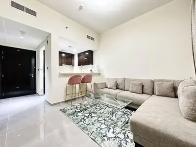 a living room with a couch and a glass table at Merano Tower 1BHK in Business Bay By Petals Holiday Homes in Dubai