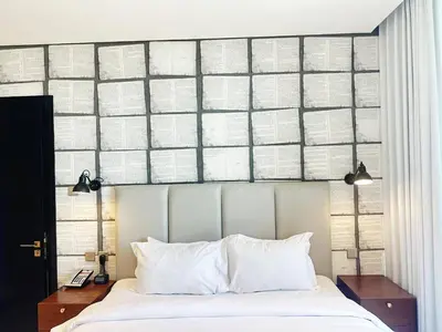 a bedroom with a large bed with white pillows at Elegant 1BR in Business Bay in Dubai