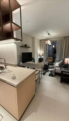 a large living room with a kitchen and a living room at Luxurious 2 Bedroom Apt in VDM Residences - Full Burj Khalifa View in Dubai