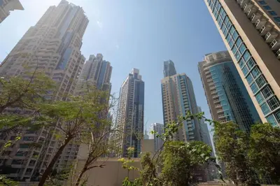 a group of tall buildings in a city at HAVN - 2 Bed in The Residences, Burj Khalifa View in Dubai