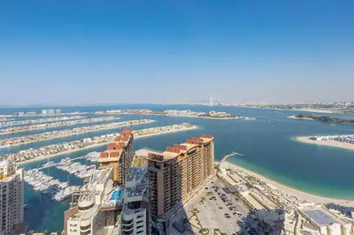 an aerial view of a city with a marina at Luxury 1BR on Palm Jumeirah with Pool Access and Beach in Dubai