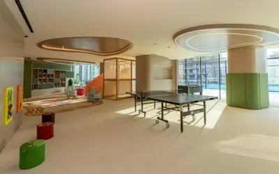 a room with a ping pong table and a desk at Urban Oasis 1BR W Private Plunge Pool in Dubai