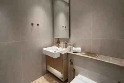 a bathroom with a sink and a mirror at Stylish Escape 1BR Plunge Pool & Pool View in Dubai
