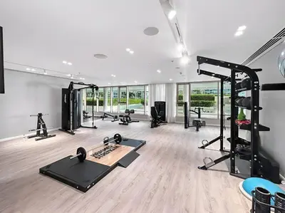 a gym with several exercise equipment in a room at Luxury one bed flat in Dubai Harbour in Dubai