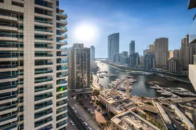 a view of a city with a river and buildings at New Bright Studio in Escan Tower, For 2, Dubai Marina in Dubai