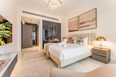 a bedroom with a bed and a living room at Community View 1BR, Perfectly Located Near the Park, Just a Short Drive Away from Dubai Top Tourist Attractions, Adhara Star, Arjan by Deluxe Holiday Homes in Dubai