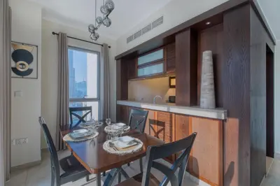 a kitchen and dining room with a table and chairs at GlobalStay Luxury Apartments The Residences Tower 8 Downtown Dubai in Dubai