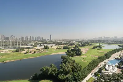 an aerial view of a river and a city at Rare 4BR Vida Golf & Pool View in Dubai