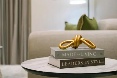 a ring sitting on top of books on a table at Brand New 1-BR with Marina and JLT Balcony Views in Dubai