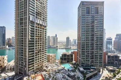 a view of two tall skyscrapers in a city at Frank Porter - Peninsula One in Dubai