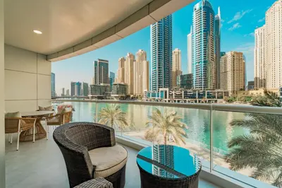 a balcony with chairs and a view of the city at Dubai Marina - Beautiful 2 Bedroom Apartment in Dubai