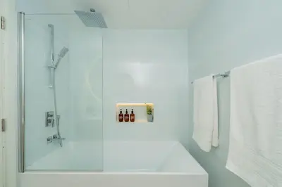 a bathroom with a shower with a glass door at Dubai Marina - Beautiful 2 Bedroom Apartment in Dubai