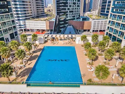 an overhead view of a swimming pool in a city at Premium Studio Burj Khalifa & Canal View in Dubai