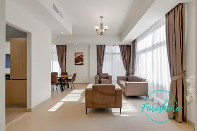 a living room with a couch and chairs and a table at Ultra Luxury Villa 5BR With Maid Room in Dubai