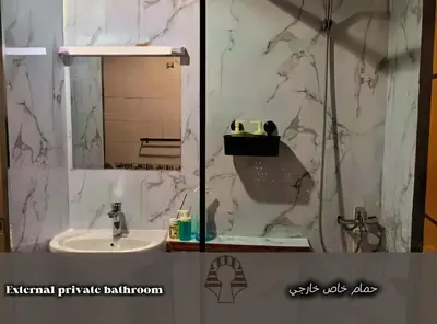a bathroom with a sink and a mirror at AlWasl Guesthouse by PHM in Dubai