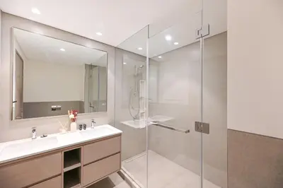 a bathroom with a sink and a shower at Golden Stays - Burj View Downtown Near Dubai Mall Sleeps 11 in Dubai