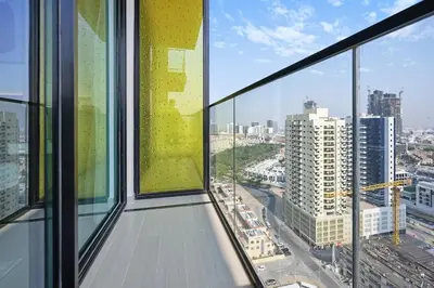 an office building with a view of a city at Golden Stays - Private Pool Modern 2BR Oasis in JVC in Dubai