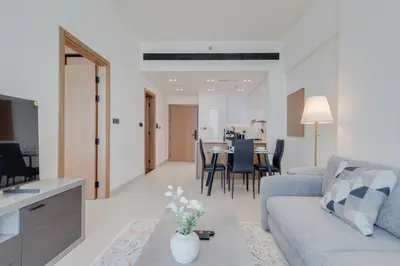 a living room with a couch and a table at Binghatti House, JVC - 1 Bedroom Apartment - Allsopp & Allsopp in Dubai