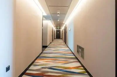 a hallway with a colorful rug on the floor at The Sky in Dubai