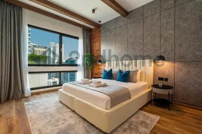 a bedroom with a large bed and a large window at Luxurious Newly Furnished 2 Bed in Dubai Marina in Dubai