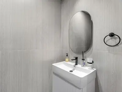 a bathroom with a white sink and a mirror at Opalz Serenity Designer- 1BDR Retreat-07 in Dubai