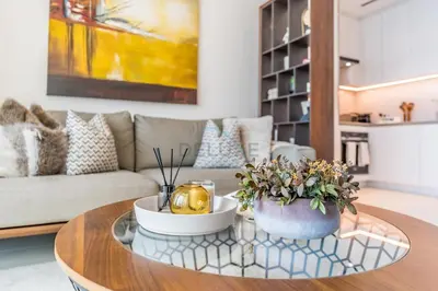 a living room with a coffee table and a couch at Balcony Facing the Marina with Partial Sea Views, Steps from the Beach and a Short Walk to Ain Dubai and Tram, The Address Residences, Jumeirah Beach Residence by Deluxe Holiday Homes in Dubai