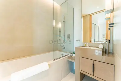 a bathroom with a shower and a sink at Balcony Facing the Marina with Partial Sea Views, Steps from the Beach and a Short Walk to Ain Dubai and Tram, The Address Residences, Jumeirah Beach Residence by Deluxe Holiday Homes in Dubai
