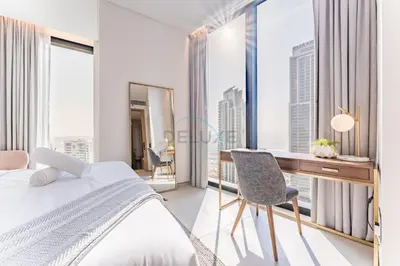 a bedroom with a desk and a bed at Balcony Facing the Marina with Partial Sea Views, Steps from the Beach and a Short Walk to Ain Dubai and Tram, The Address Residences, Jumeirah Beach Residence by Deluxe Holiday Homes in Dubai
