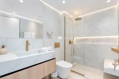 a bathroom with a shower and a toilet and a sink at Burj Khalifa View 5 Min walk to Dubai Mall in Dubai