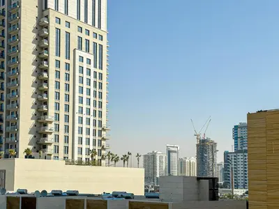 a view of a city with tall buildings at WelHome - Urban Comfort Studio in JVC in Dubai