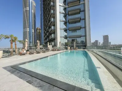 a swimming pool in the middle of a building at Luxury 2BR Nobles Tower Business Bay by Czechin in Dubai