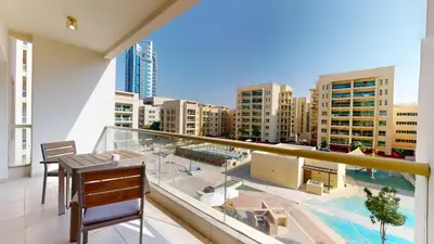 a balcony with a view of a city at Vacationer l Peaceful 2 Bed l Sheikh Zayed Road l The Greens in Dubai