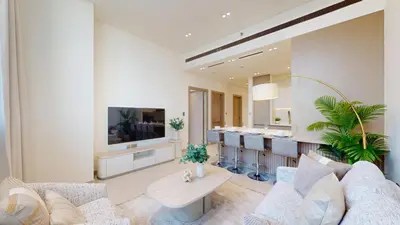 a living room with a couch and a kitchen at Locations l Aesthetic 1 Bed l Own Private Pool l Circle Mall in Dubai