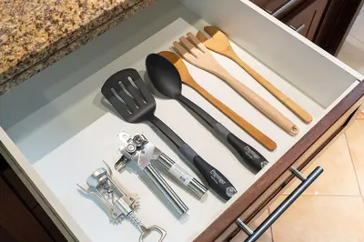 a drawer filled with cooking utensils in a kitchen at Pool View 2BR with Big Balcony in Dubai