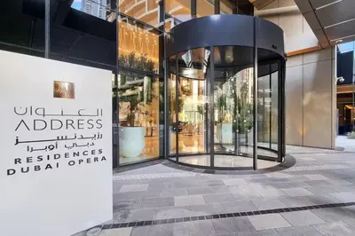 a store front with a sign on the side of a building at Vogue Downtown Address Residence near Burj Khalifa and Dubai Mall, Two Bedroom Apartment with Balcony and Burj Khalifa view, Access to all Amenities in Dubai